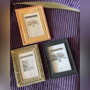 Three picture frames that fit 4” x 6” photos.  One has raised gold leaf pattern
